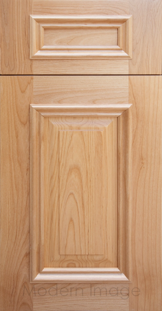 Heritage custom cabinets in a Natural Stain, classic raised panel doors, and modern flat slab drawer fronts.